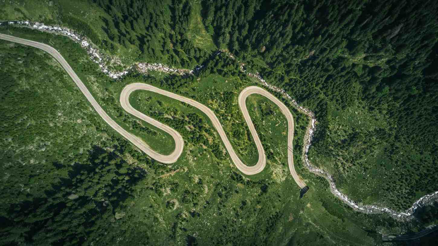 curvy-road-sky-view-in-forest